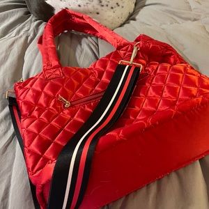 ADHORNED fabric tote with accessories and two straps.